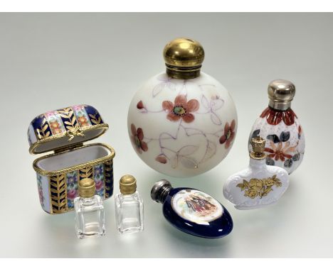 An Edwardian opaque glass ball perfume bottle with floral and leaf hand painted design and screw top: h. x 10cm, an Edwardian