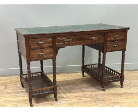 A carefully restored Edwardian walnut kneehole desk, with modern green leather gilt tooled skiver, with centre frieze drawer 