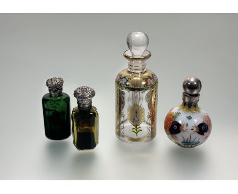 A uranium green glass faceted scent bottel with white metal hinged top and original stopper: h. x 6cm, a modern opague glass 