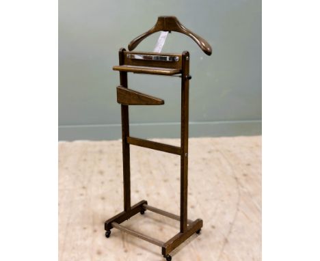 An oak framed vintage Corby of Windsor Versatile Valet with jacket hanger and tray with fold out trouser hanger, raised on ca