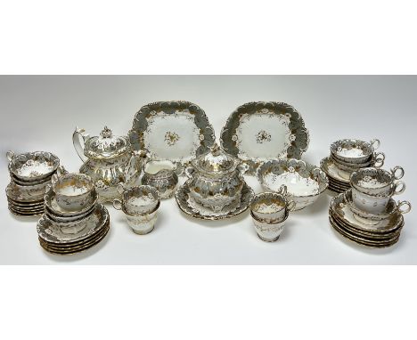 A mid 19thc English porcelain part tea service decorated with grey and gilt scrolls comprising, a teapot, ten teacups, seven 