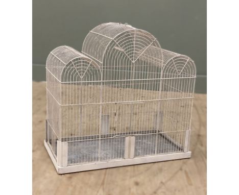 A vintage style cream painted finish triple arched bird cage, with slide out galvanised tray to base (h.60cm x l.61cm x d.31c