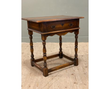 A reproduction hardwood lowboy lamp table with plank top and single drawer, on turned baluster support (h.73cm x l.73cm x d.4