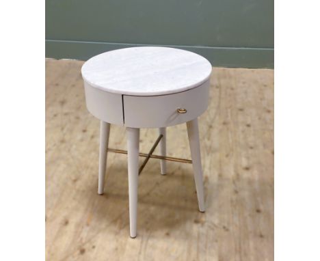 A penelope lamp table with a white, circular marble top and single frieze drawer raised on tunred, tapered legs: h. x 55cm d.