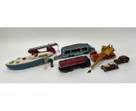 A colletion of diecast model Dinky toys to include, a transporter, crane, a tanker, an American-style fire truck, two vintage