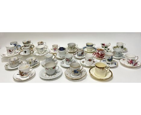 A large collection of porcelain and fine bone china teacups and saucers comprising, Hutschenreuther decorated in 'Blue Onion'