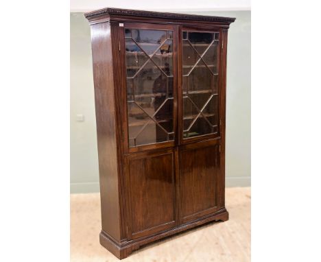A 19th century mahogany bookcase, the upper section with a pair of astragal glazed doors enclosing adjustable shelves, the lo