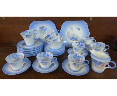 A Shelley Phlox tea service, twelve cups, saucers and side plates, cream jug, sugar and two larger plates, some a/f 