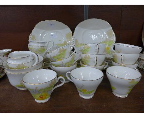 A Taylor &amp; Kent Longton part tea set including twelve cups, eleven saucers and ten side plates 