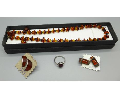Two pairs of amber earrings, an amber ring and an amber necklace and earring set 
