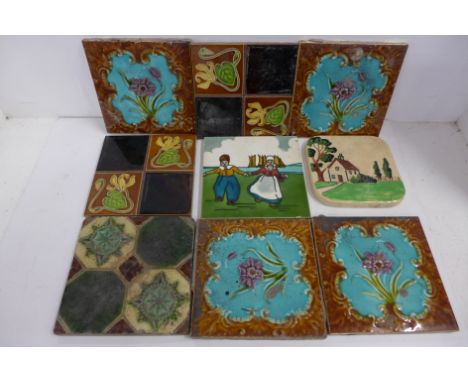 A collection of seven Victorian and later fireplace tiles and one other tile 