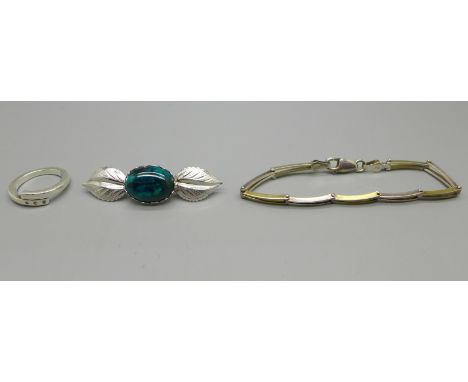 A silver bracelet, brooch and ring 