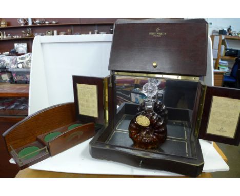 A Remy Martin Cognac display cabinet, decanter (bottle for display only) and a Bowmore Islay single malt bottle and glass sta