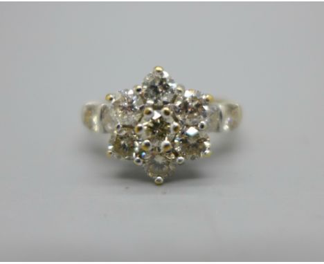 An 18ct gold, eleven stone brilliant cut diamond cluster ring, shank stamped 2ct diamond weight, 4.8g, O 