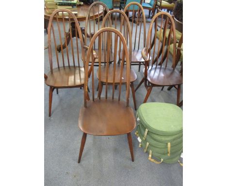 Four 1960s Ercol dark staining Quaker dining chairs and two matching carvers and six green cushions 