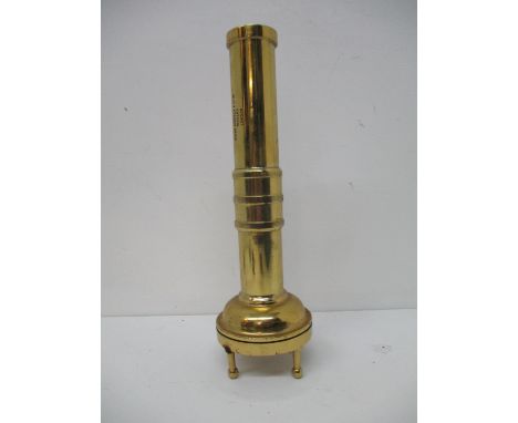 A mid 20th century brass divers torch, the detachable screw head set with a magnifying lens and four turned feet, the handle 