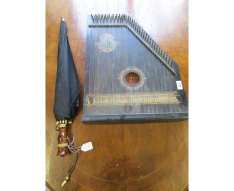 A Mandolin Harp and a wooden and bone handled umbrella 