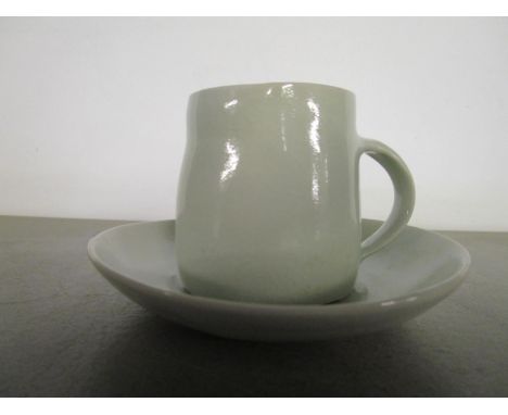 Edmund de Waal (b 1964) - studio pottery - a pale Celadon cup and saucer, impressed potters seal mark to base edge of cup, cu