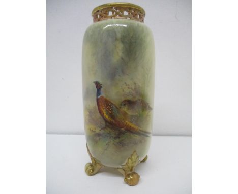 An early 20th century Royal Worcester vase of cylindrical form, with a pierced rim, decorated with a cock pheasant and anothe