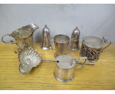 A selection of silver and silver plated items to include a ladle, embossed cream jug, pierced mustard pot and other items 