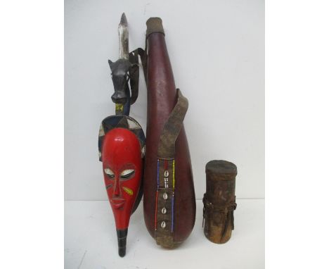 Vintage African tribal vessels and artefacts to include a wooden and animal skin honey pot with a detachable lid, 9 1/2"h, an