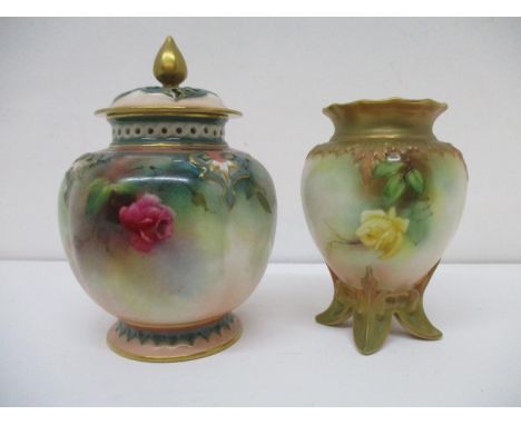 A Royal Worcester pot and cover of lobed form with a pierced lid and collar, decorated with roses and foliage, on a splayed f