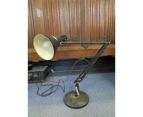 Industrial design - a vintage anglepoise lamp in black, circa 1980 and a cased Singer sewing machine, serial number EN191196,