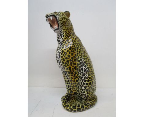 A large Italian floor standing terracotta model of a seated cheetah, stamped marks to base, circa 1970, 29 1/2" h