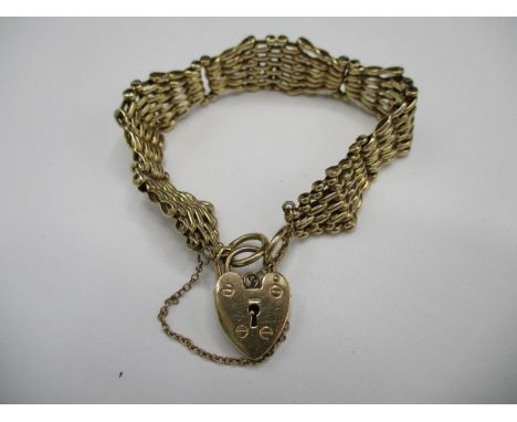 A 9ct gold wasted gate link bracelet with a padlock clasp, 25G 