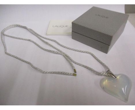 Lalique- An Amoureuse Beaucoup opalescent crystal heart necklace with a silver pendant link and adjustable cord, in original 