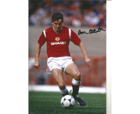 Arthur Albiston 12x8 Signed Colour Photo Pictured Playing For Man Utd. Good Condition. We combine postage on multiple winning