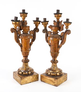A PAIR OF ITALIAN SILVERED AND GILT WOOD THREE LIGHT CANDELABRA (2)19th Century 
Each fluted vase form stem inlaid with mirro