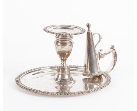 A GEORGE IV SILVER CHAMBER CANDLESTICKDecorated with a gadrooned rim, diameter 14.7cm, with a detachable sconce and snuffing 