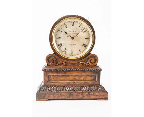 A VICTORIAN WALNUT DRUM-TOP STRIKING MANTEL CLOCKBy French, Royal Exchange, LondonThe drum-top case supported on a pair of sc