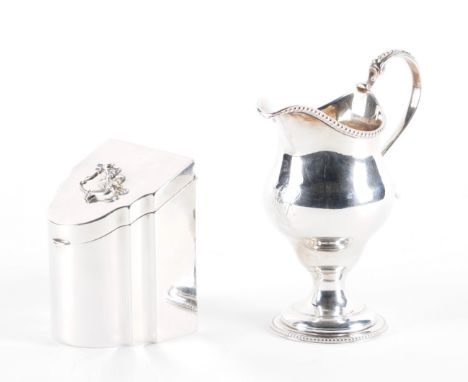 A SILVER TEA CADDY AND A SILVER CREAM JUG (2)The tea caddy modelled as a miniature Georgian knife box, with a rococo shaped h