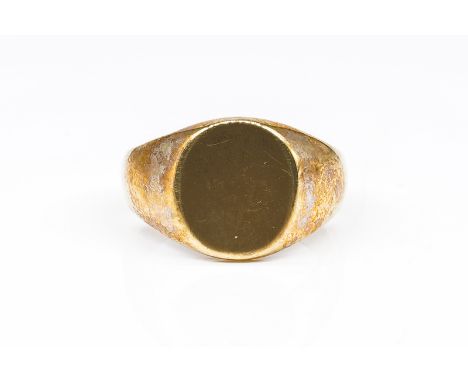 A 9CT GOLD SIGNET RINGOf plain oval design, ring size M and a half, weight 6.1 gms, with a case