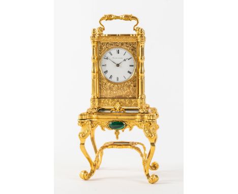 AN UNUSUAL ENGRAVED GILTBRASS AND MALACHITE MINIATURE TIMEPIECE WITH A MALACHITE-MOUNTED STANDThe timepiece by Barwise, Londo