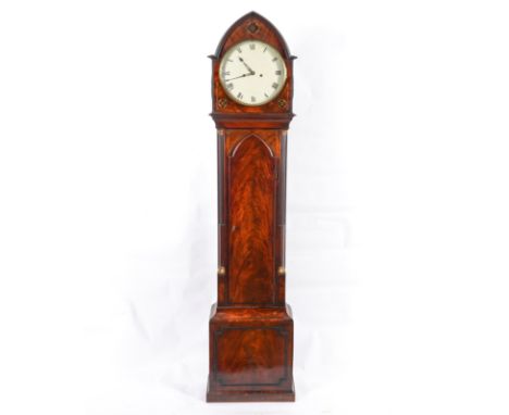 A LATE REGENCY MAHOGANY AND BRASS INLAID LONGCASE CLOCKSigned Bentley & Beck, Royal Exchange, LondonThe lancet top case with 