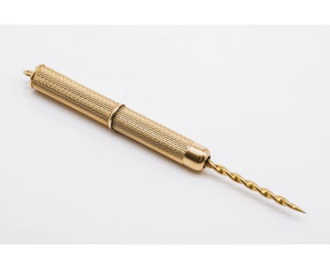 A 9CT GOLD CIGAR PRICKERWith engine turned decoration, gross weight 5.3 gms