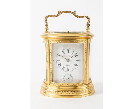 A  FRENCH ENGRAVED GILT BRASS STRIKING AND REPEATING OVAL CARRIAGE CLOCKRetailed by R. P. Donaldson, Carlow, circa 1885The ov