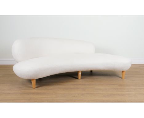 A MODERN ASYMMETRIC CONCAVE WHITE UPHOLSTERED SOFA215cm wide; 80cm highUpholstery has some marks and is worn in places, see a