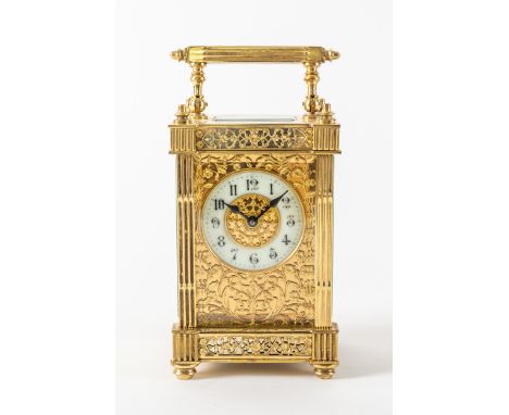 A FRENCH BRASS CARRIAGE TIMEPIECEBy Couaillet, Saint Nicholas-d’Aliermont, circa 1910The case with a reeded handle and uprigh