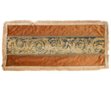 A FLEMISH VERDURE TAPESTRY FRAGMENT BANNER DEPICTING SCROLLING FOLIAGELate 17th / 18th Century  Later mounted on to a velvet 