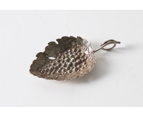 A GEORGE III SILVER CADDY SPOONModelled as a leaf with a coiled handle, by Joseph Willmore, Birmingham probably 1814, length 