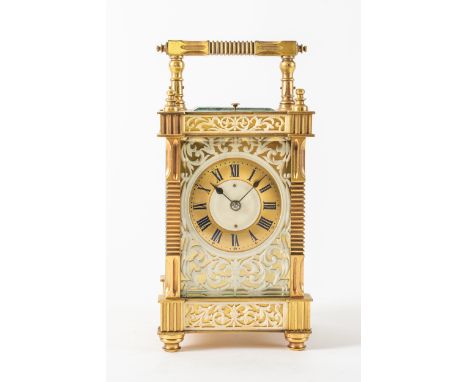 A FRENCH GILT BRASS, IVORY MOUNTED, STRIKING AND REPEATING CARRIAGE CLOCKCirca 1910The case with reeded handle and uprights, 