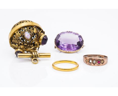 AN AMETHYST BROOCH, TWO GOLD RINGS AND ANOTHER ITEMThe Victorian amethyst in a closed collet gold setting, unmarked, weight 7