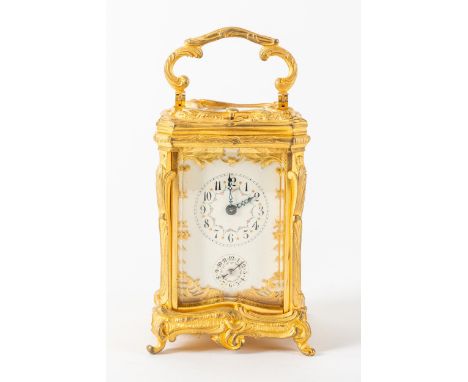 A FRENCH GILT BRASS STRIKING AND REPEATING ROCOCO STYLE CARRIAGE CLOCKCirca 1910The case cast with foliate scrolls, shaped ha