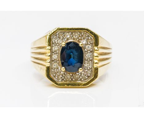 A GOLD SAPPHIRE AND DIAMOND RINGOf cut cornered rectangular form, claw set with the oval cut sapphire at the centre within a 