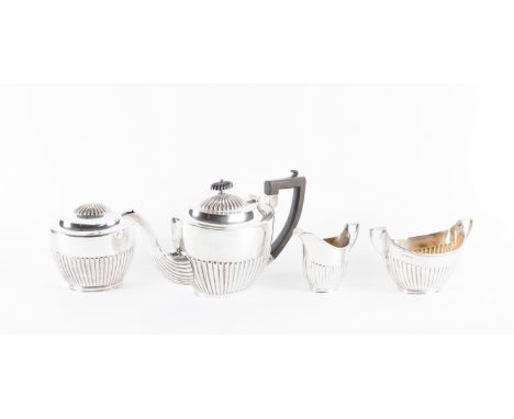 A SILVER COMPOSITE THREE PIECE TEA SET AND A PLATED TEA CADDYComprising; a teapot, a twin handled sugar bowl and a milk jug, 