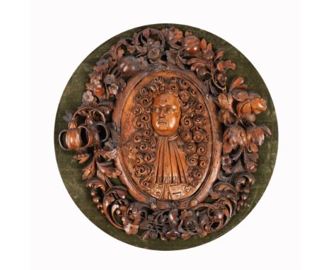 A CHARLES II CARVED LIMEWOOD PORTRAIT PLAQUEAttributable to the workshop of Grinling Gibbons (1648-1721), circa 1680  Carved 